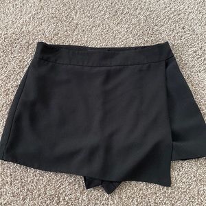 Black short skort with front apron style